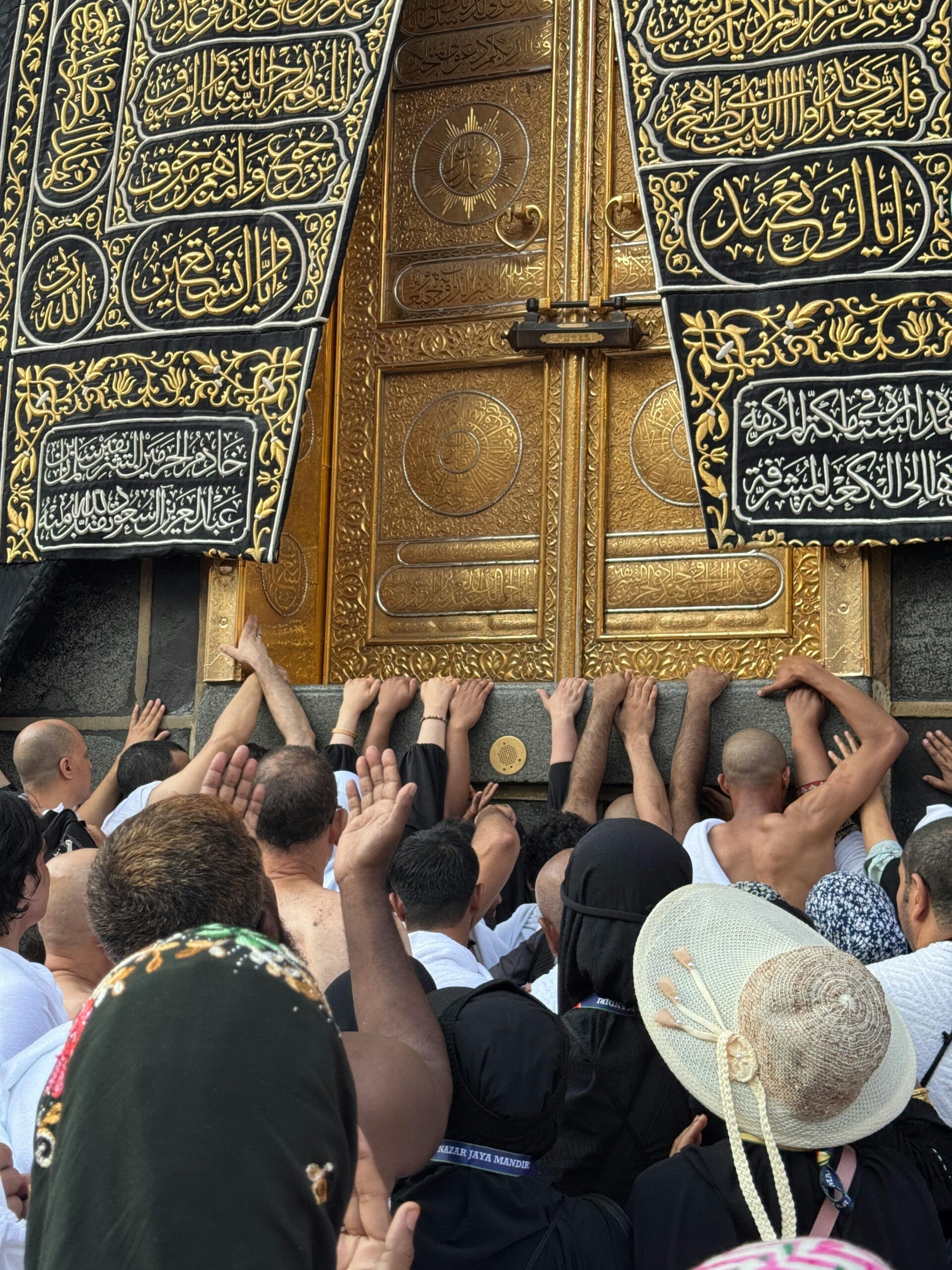 Faithful pilgrims gathered in prayer at the sacred Kaaba in Mecca, capturing a moment of devotion.